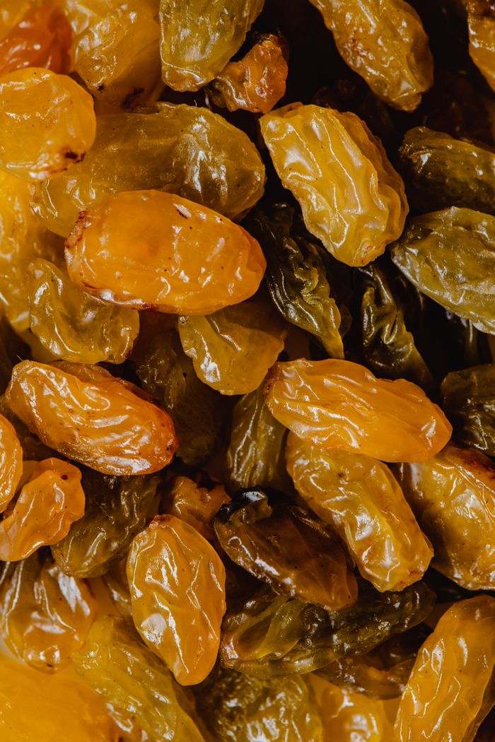 services-02 Close-up view of golden raisins showcasing their natural texture and vibrant colors.